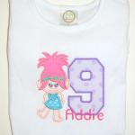 This design comes with the applique Troll and a name.  Extra to add an applique number.