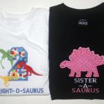 The mini dinosaurs are totally embroidered.  The "2" shirt may be more $$ due to the amount of stitches.  PE