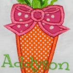 An adorable carrot applique with ribbons on top.  Great for Easter or all year.